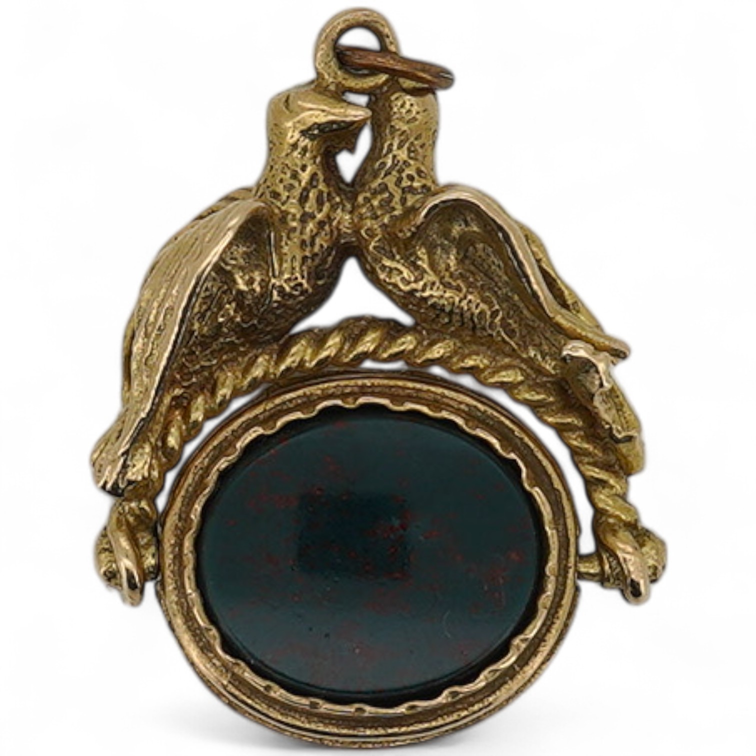 A 9ct gold mounted carnelian and bloodstone set spinning fob, with twin bird surmount, 29mm.